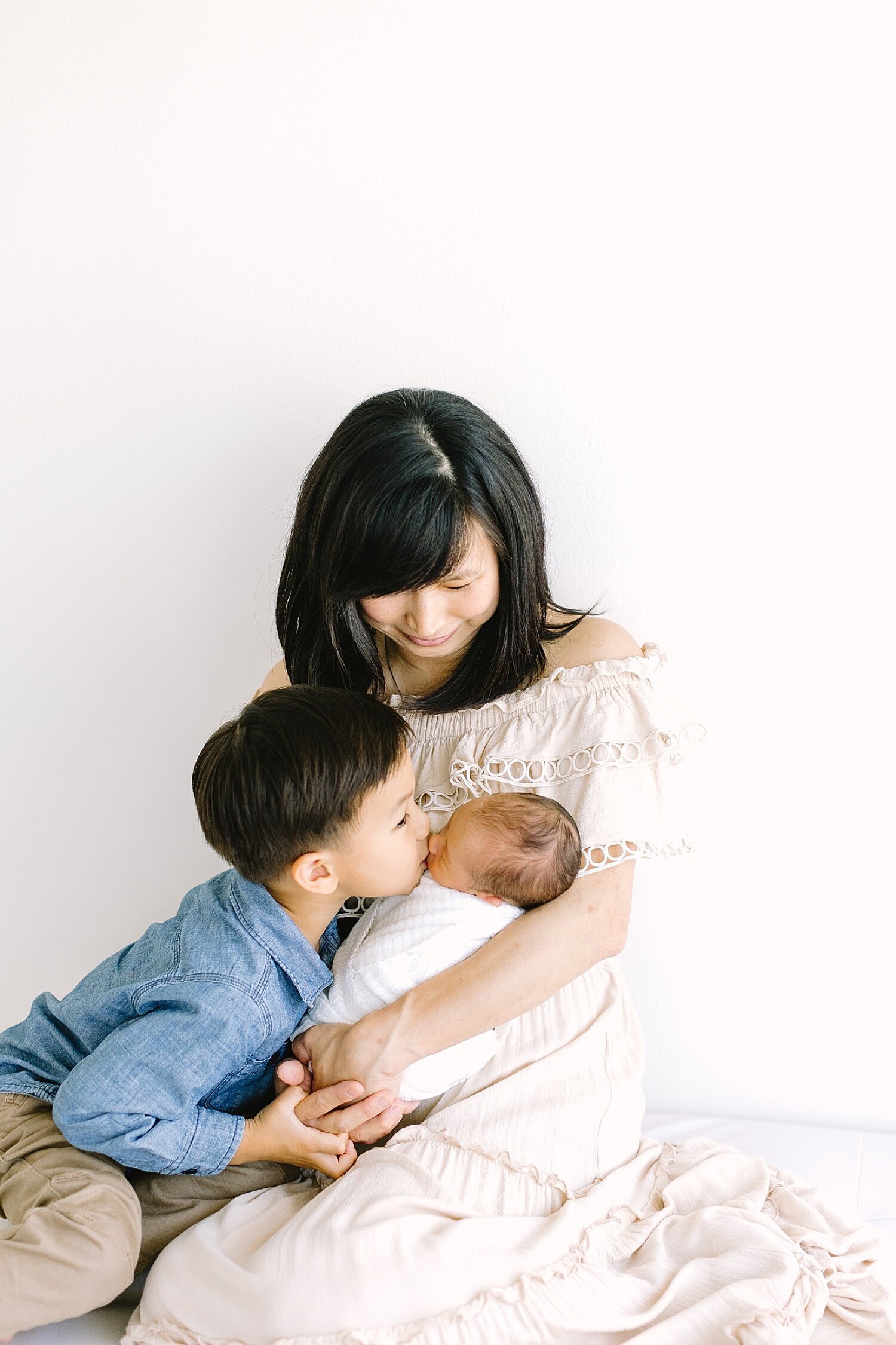 Mom holding her two boys | Ambre Williams Photography