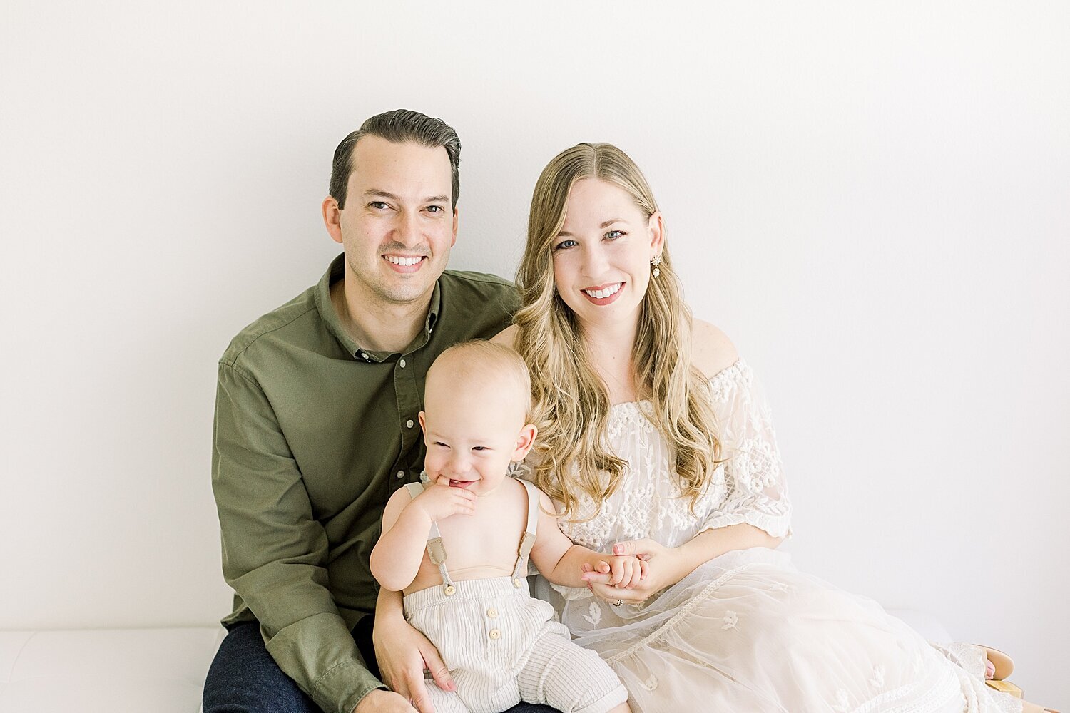 Family portrait with Mom, Dad and one-year-old son. Photo by Ambre Williams Photography.