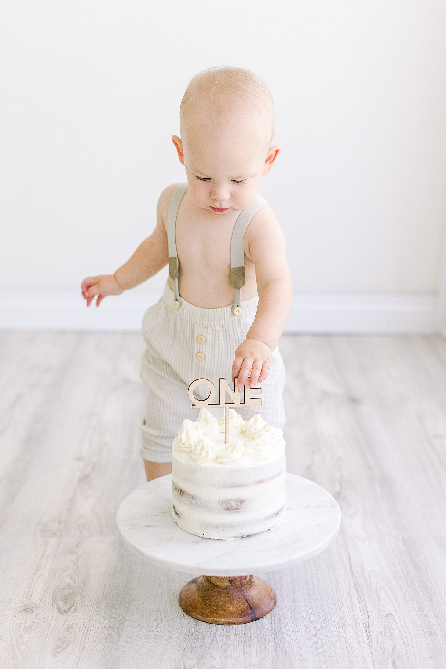 Cake smash with one-year-old boy. Photos by Ambre Williams Photography in Newport Beach.