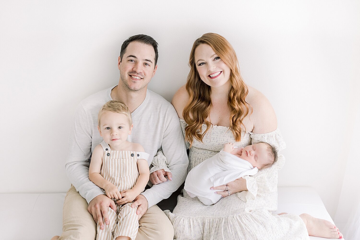 Family portrait during studio newborn session in Newport Beach. Photo by Ambre Williams Photography.