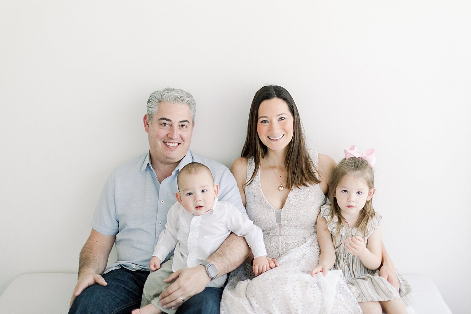 Family portrait in Newport Beach Studio during baby boy's first birthday session with Ambre Williams Photography.