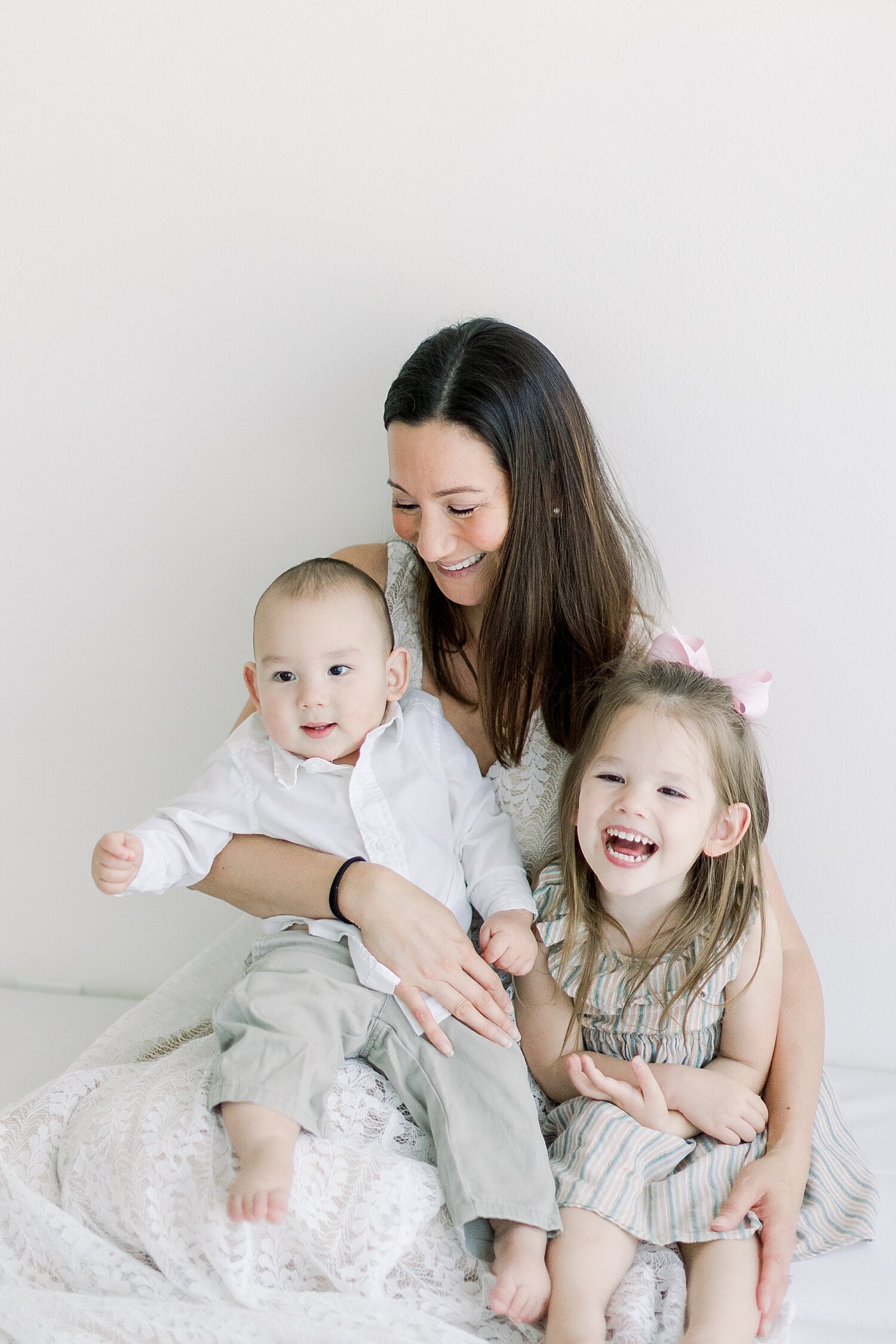 Photo of Mom with her daughter and son. Photo by Ambre Williams Photography.