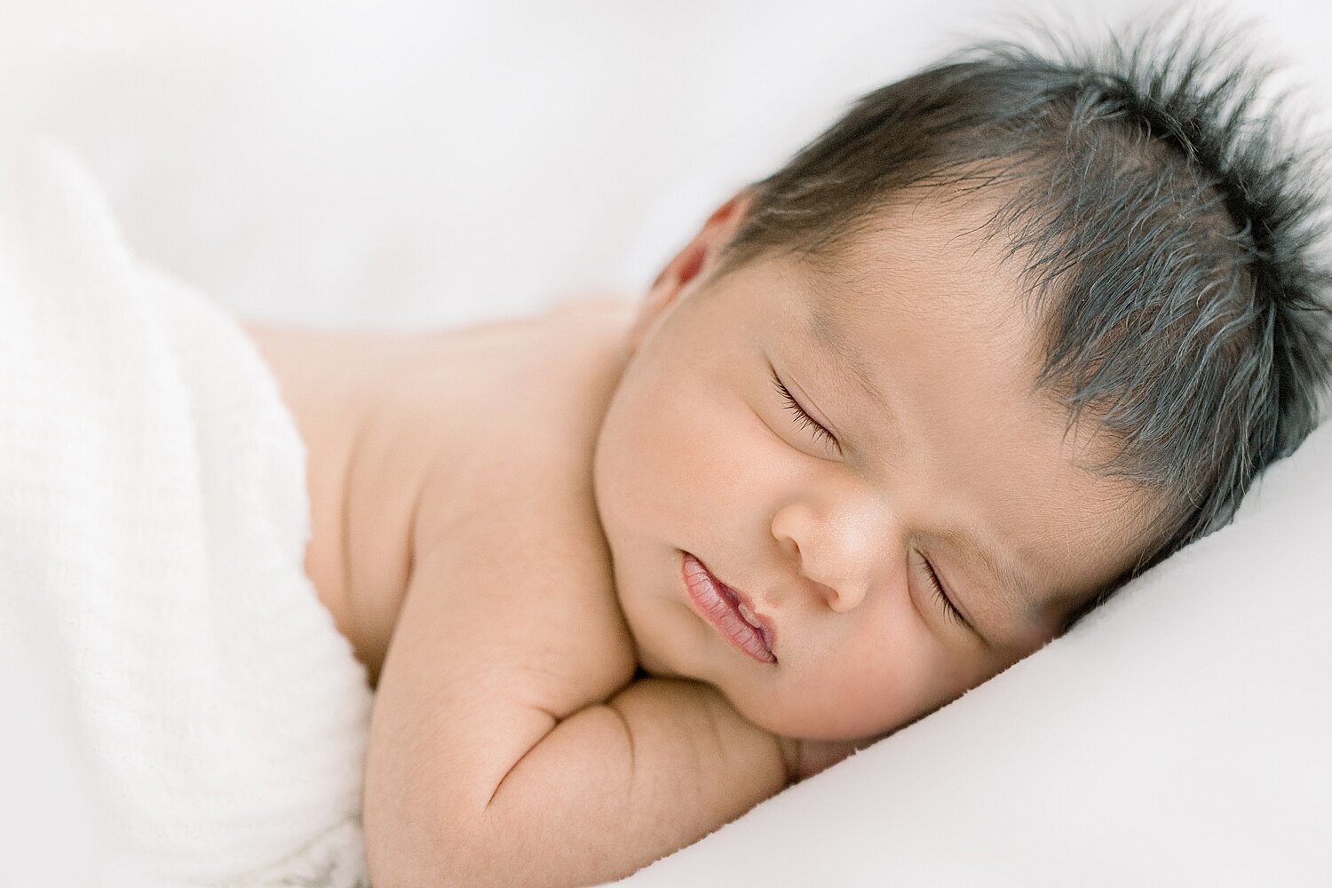 Newborn baby boy asleep. Photo by Ambre Williams Photography in Newport Beach.