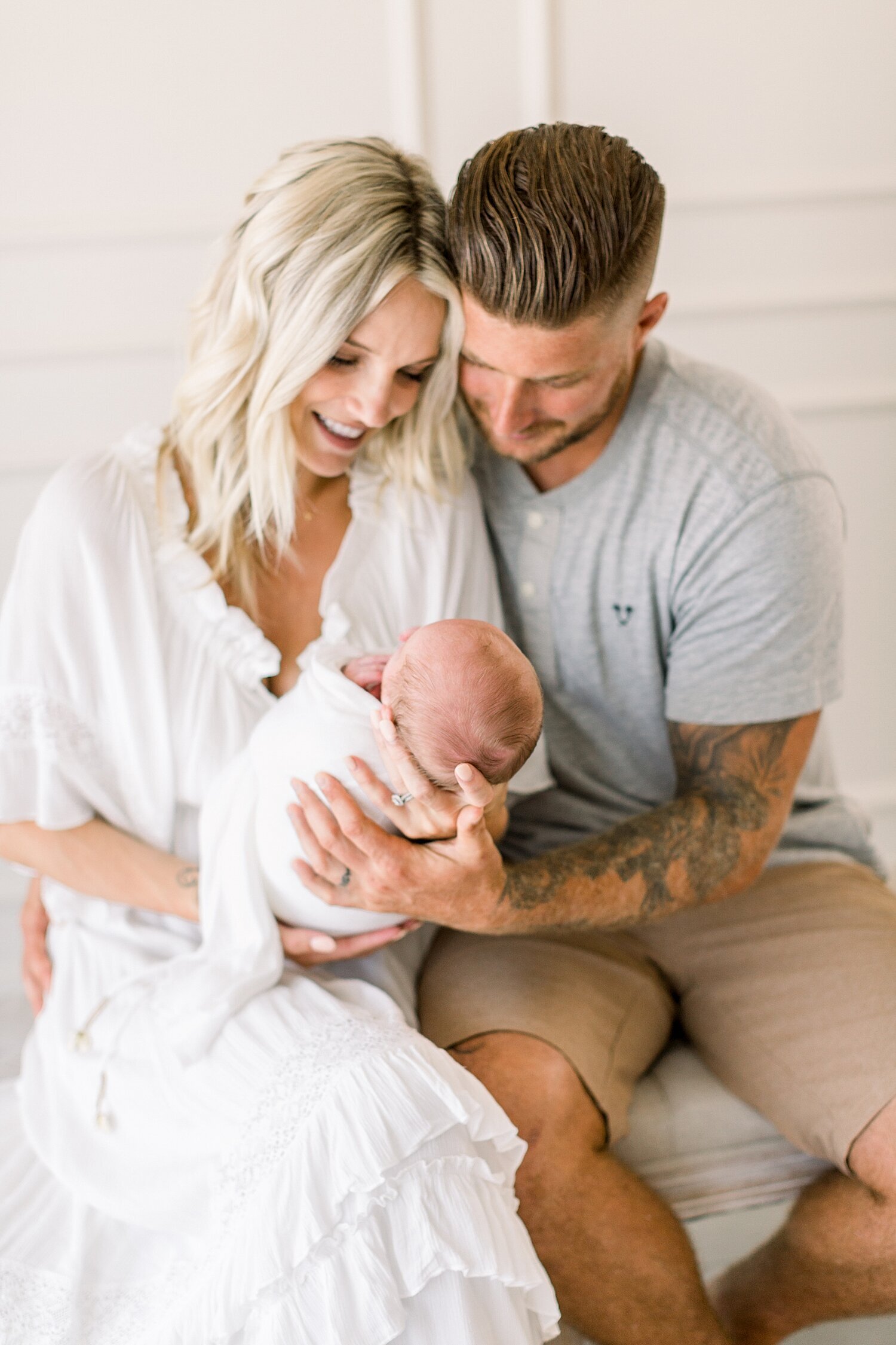 Mom and Dad with their fourth baby, a boy! Photos by Ambre Williams Photography.
