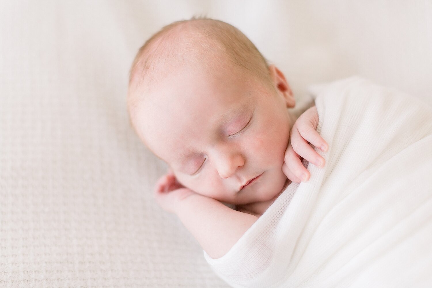 Baby boy sleeping for photos with Ambre Williams Photography