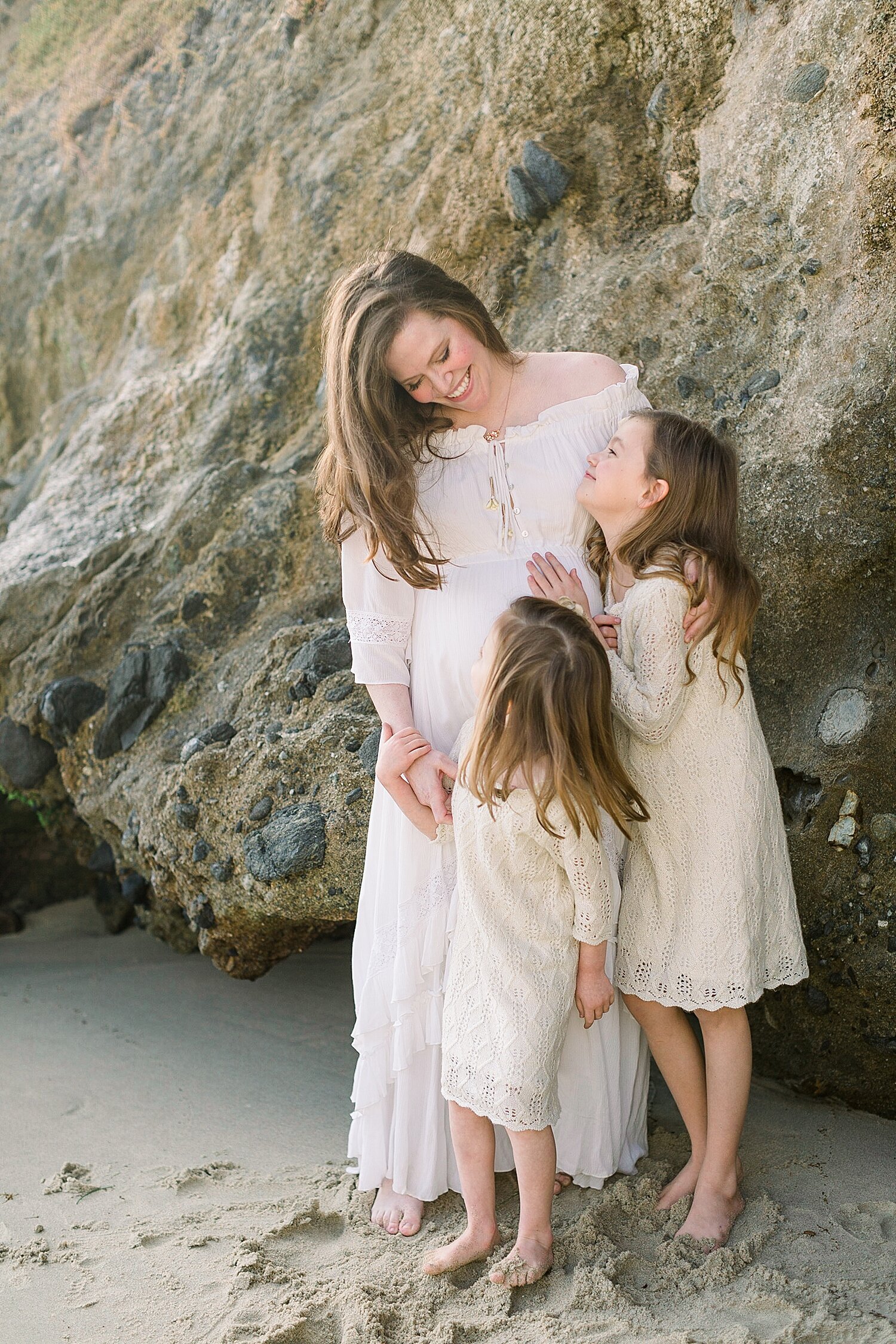Mom and her two girls in front of the coastal bluffs. Photos by Ambre Williams Photography.