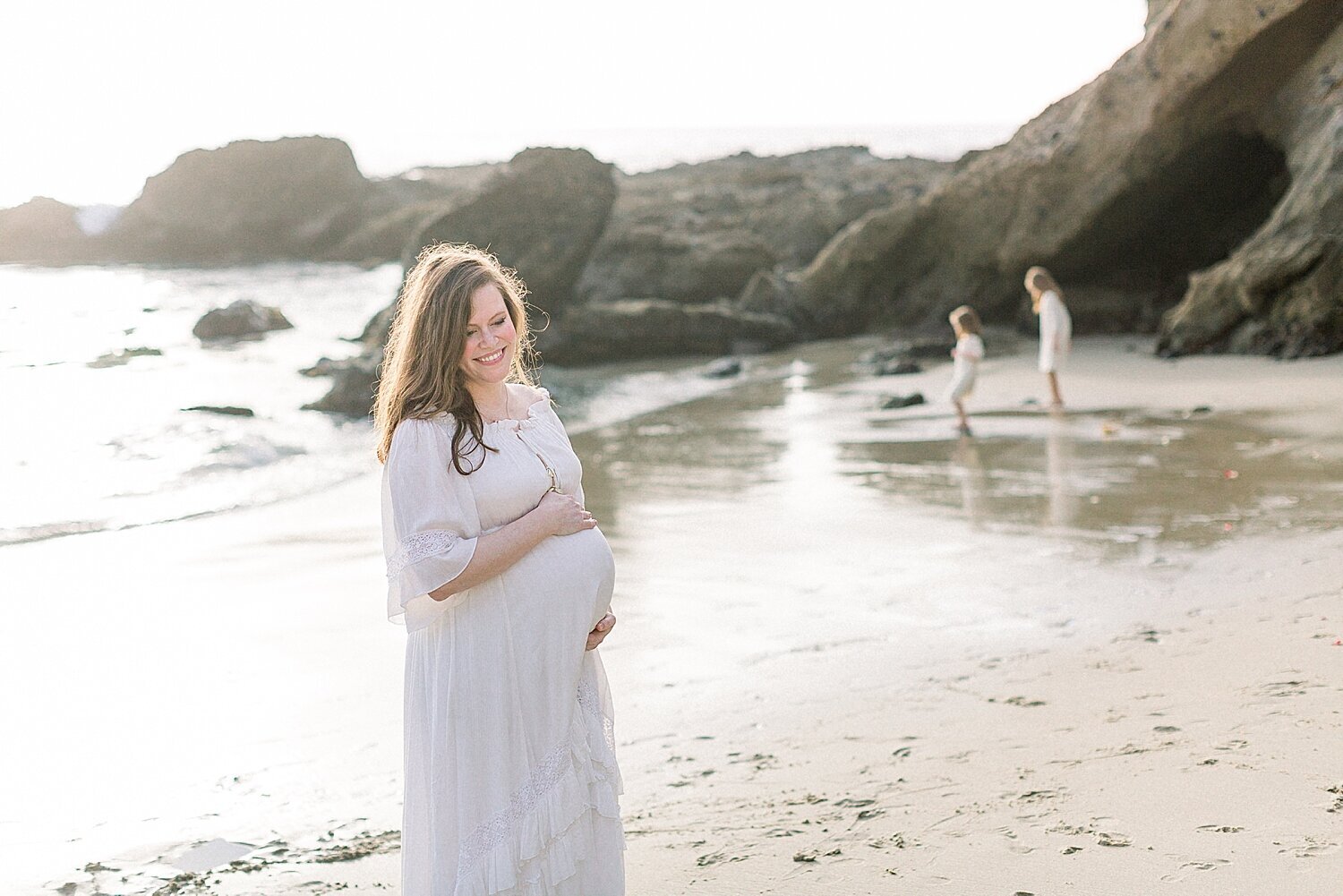 Sunset maternity session at Corona del Mar in Southern California. Photos by Ambre Williams Photography.