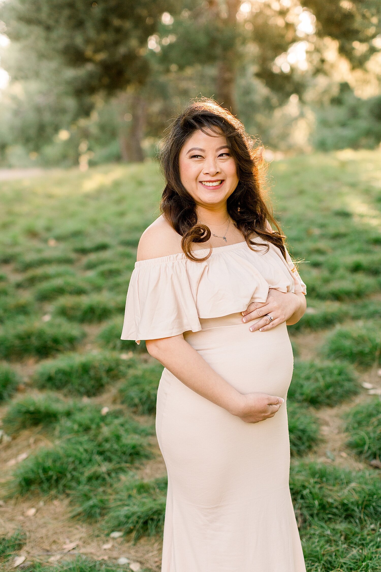 Beautiful Mama-to-be wearing a maternity dress for photoshoot. Ambre Williams Photography.
