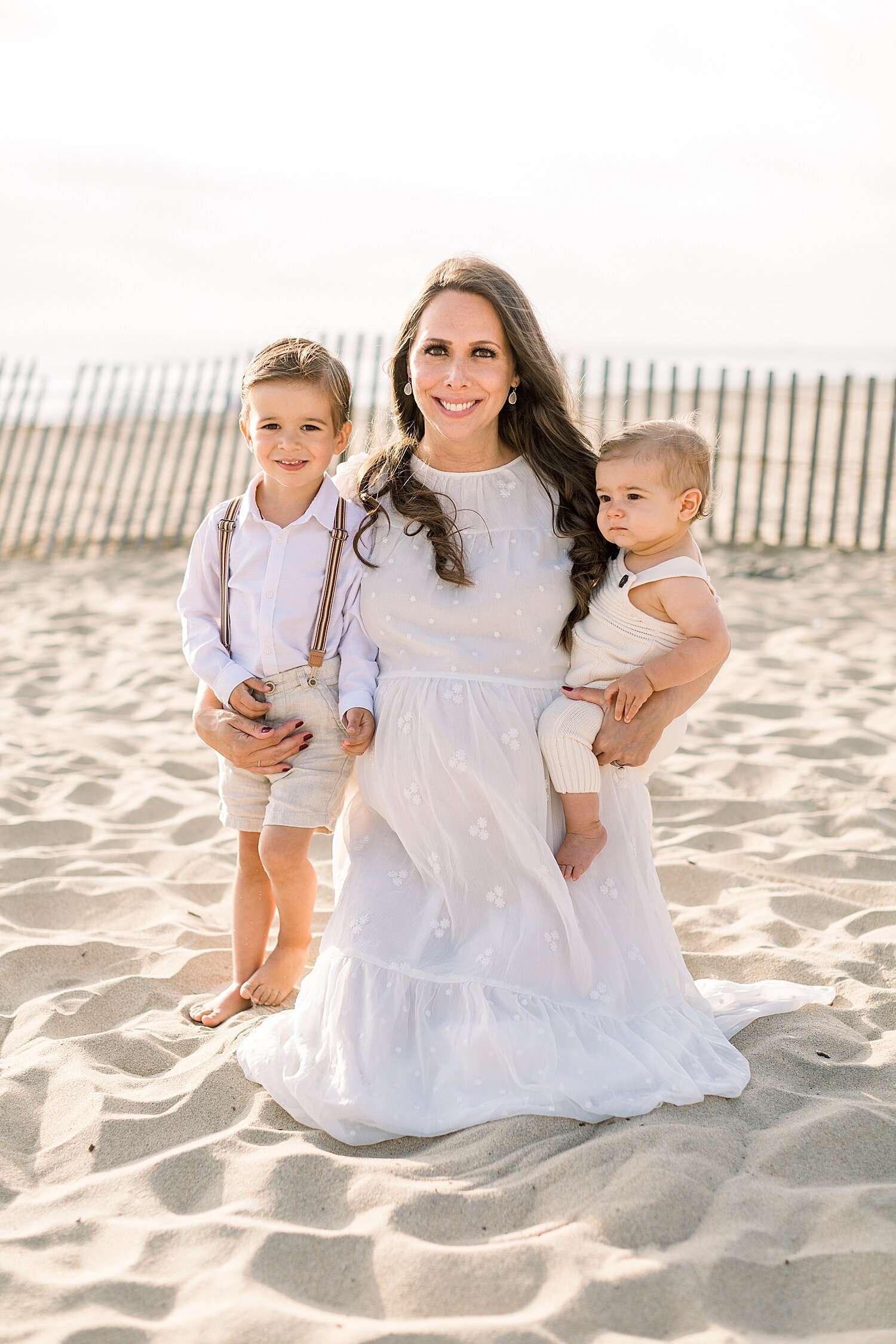 Mom and her two boys on the beach. Photo by Ambre Williams Photography.