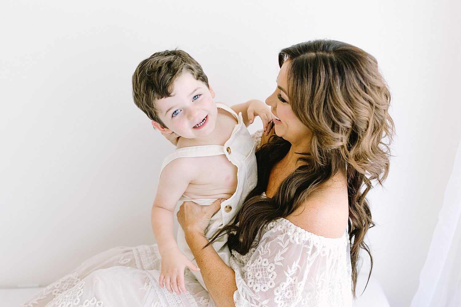 Mother-son photos in studio in Newport Beach with Ambre Williams Photography.