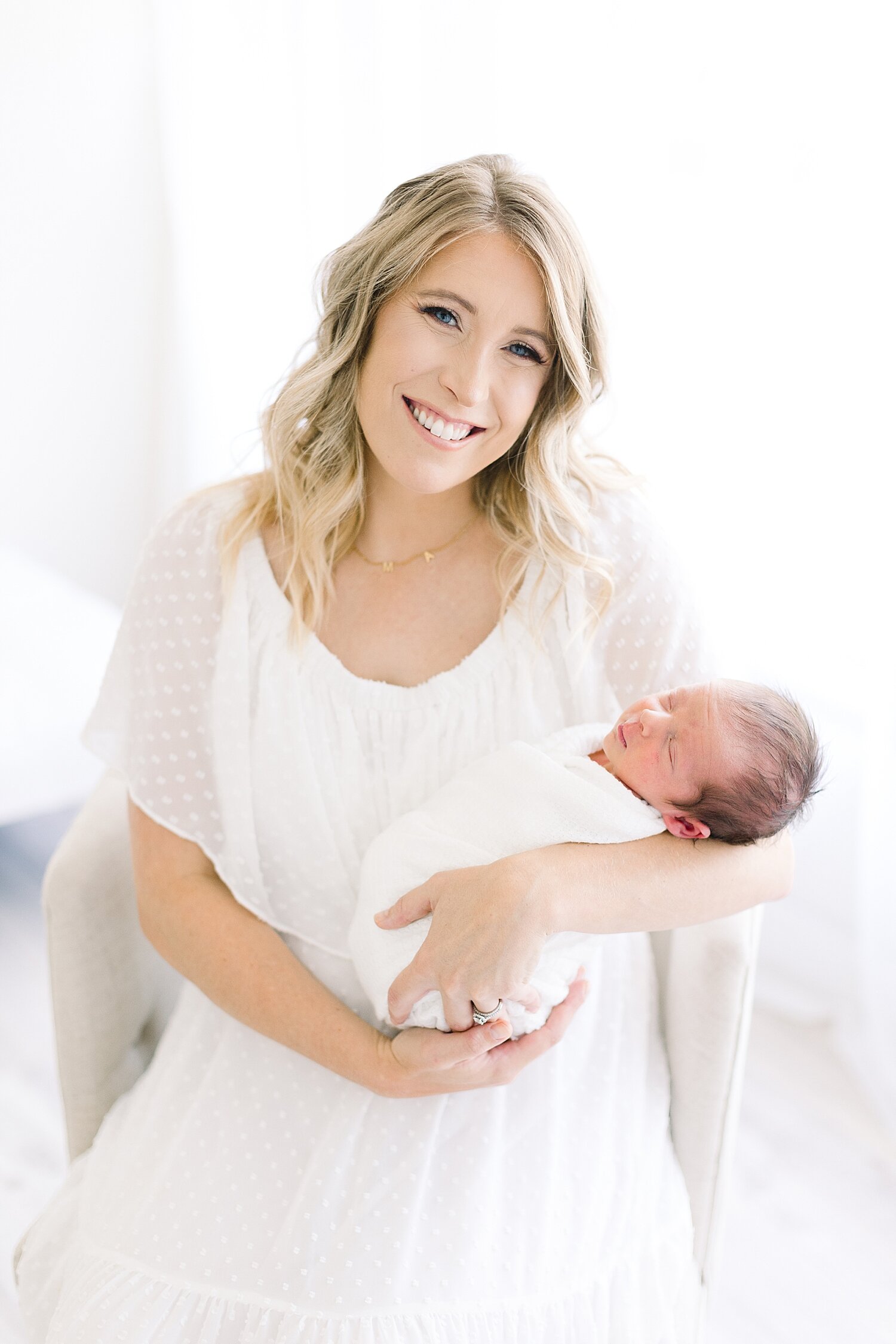 Mom holding her newborn son | Ambre Williams Photography