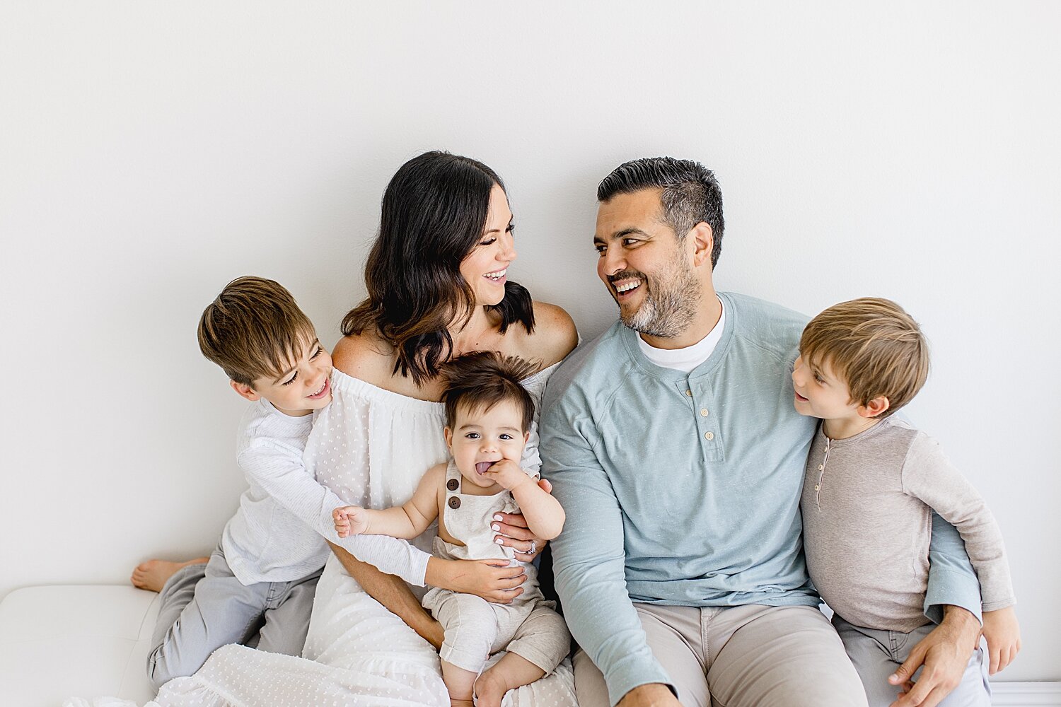 Mom and Dad with three boys | Photo by Ambre Williams Photography