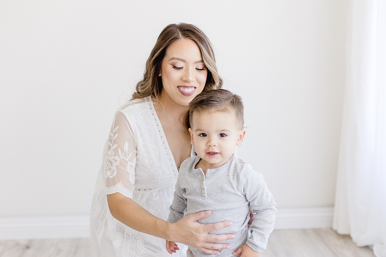 Mom and toddler-aged son together during maternity photos with Ambre Williams Photography.