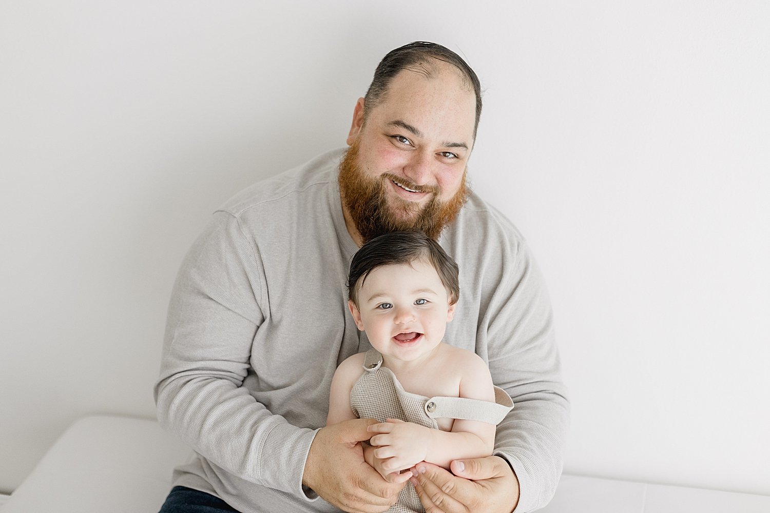 Father-son photo during first birthday session with Ambre Williams Photography.