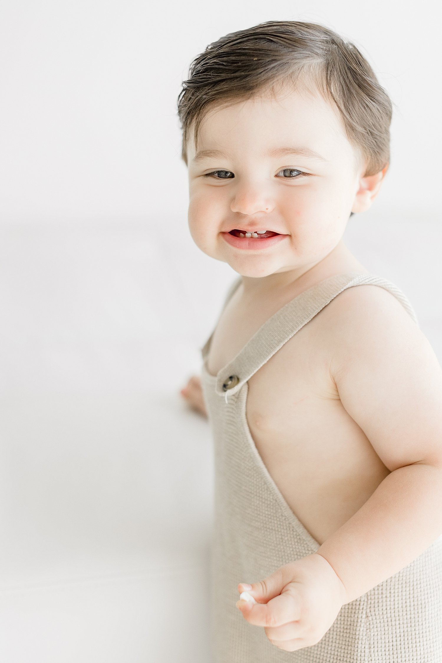 One year old little boy during his birthday photoshoot with Ambre Williams Photography.