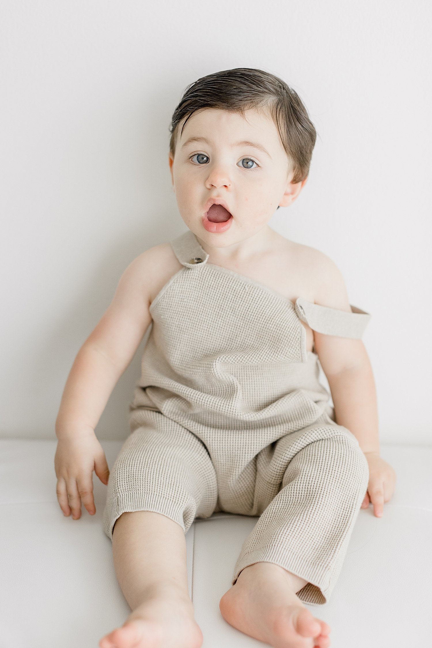 One year old little boy during his birthday photoshoot with Ambre Williams Photography.