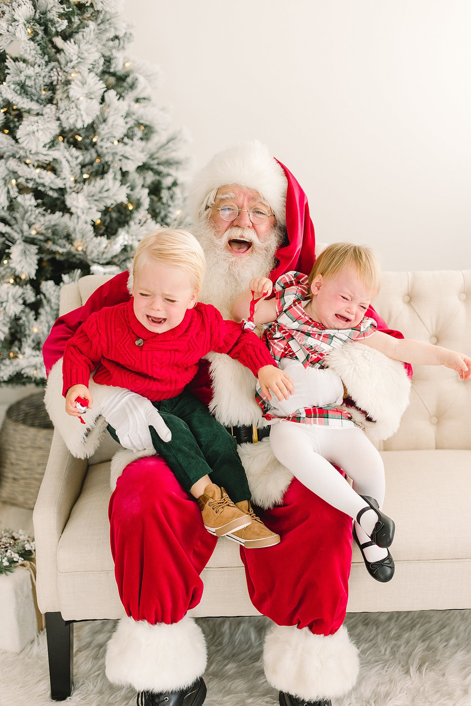 Kids sitting on Santa's lap | Ambre Williams Photography