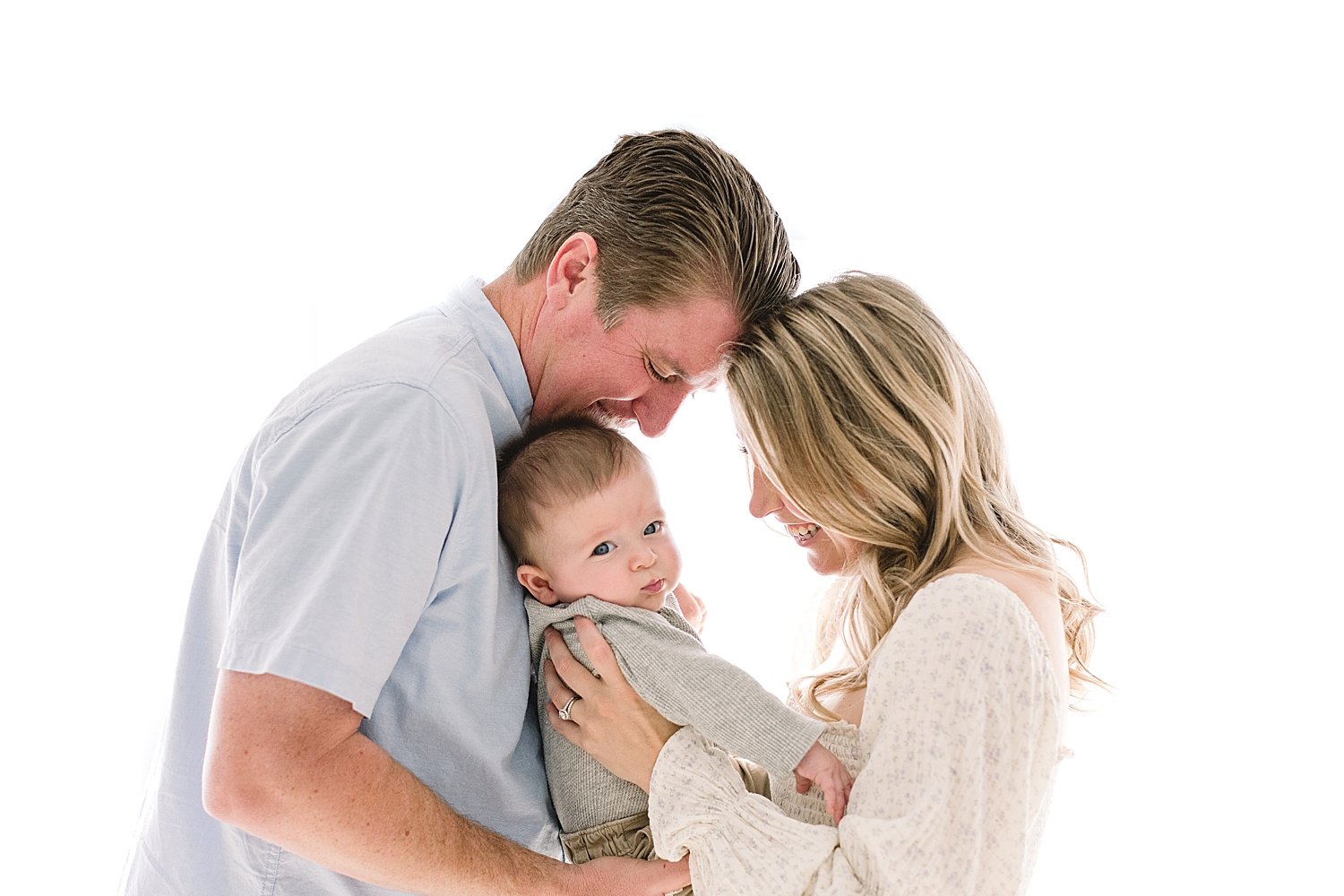 Mom and Dad with their six month old son | Ambre Williams Photography