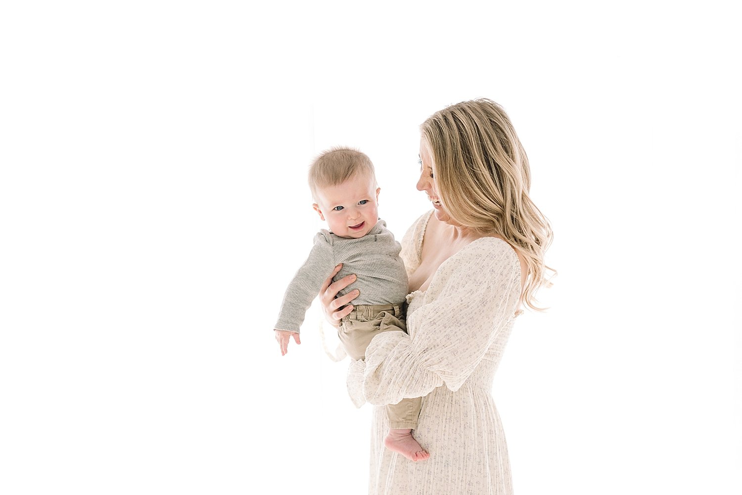 Mom holding and snuggling her six month old baby boy | Ambre Williams Photography