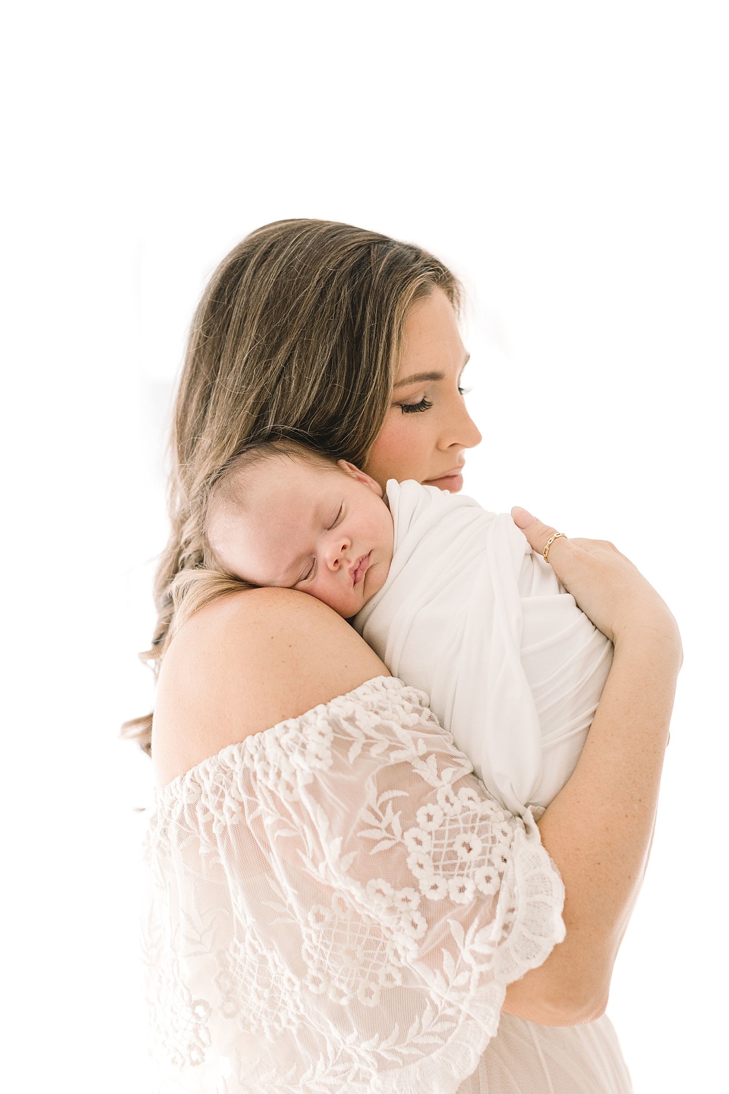 Baby boy laying on Mom's shoulder | Ambre Williams Photography