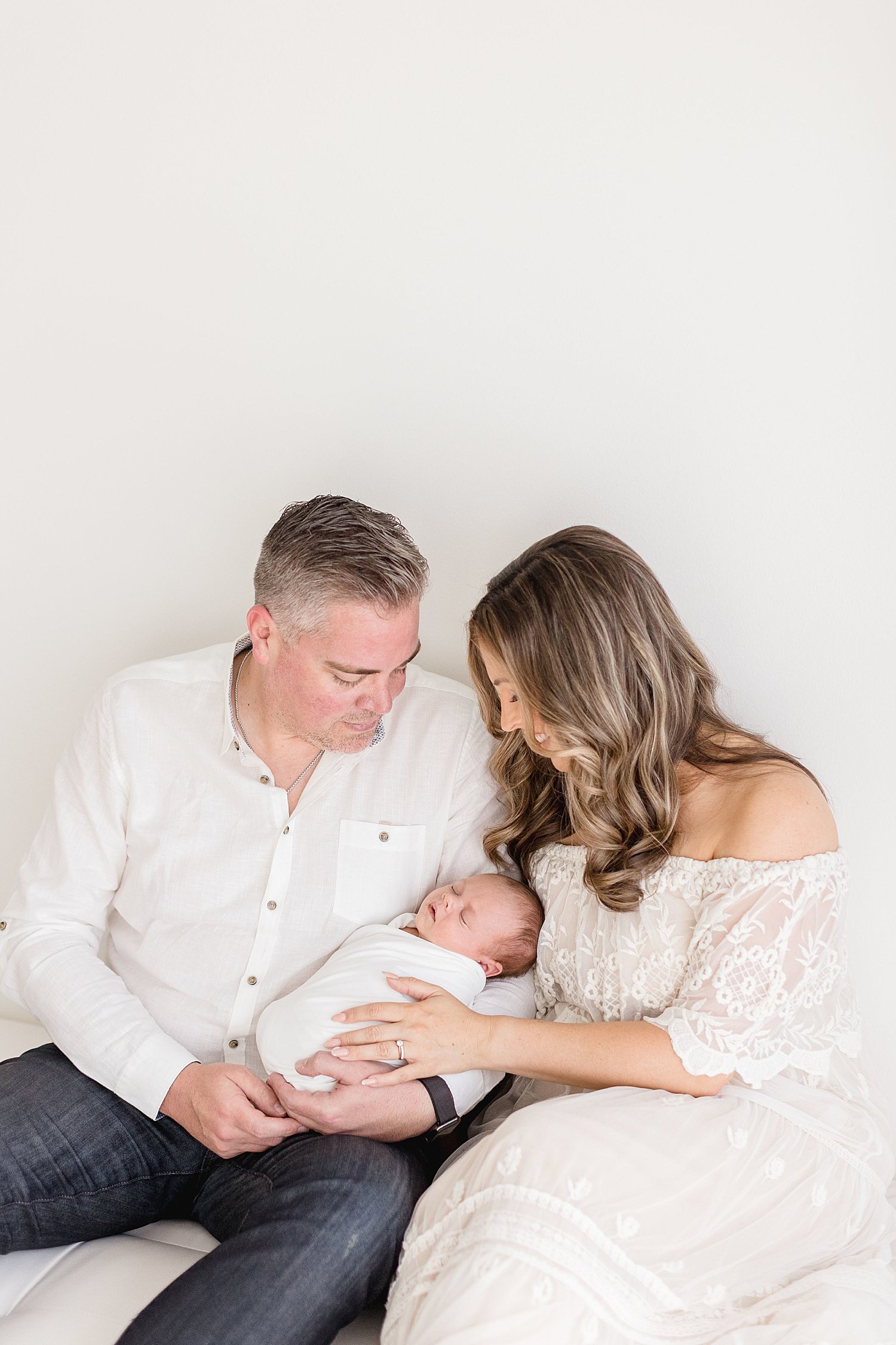 Mom and Dad with their newborn baby boy | Ambre Williams Photography
