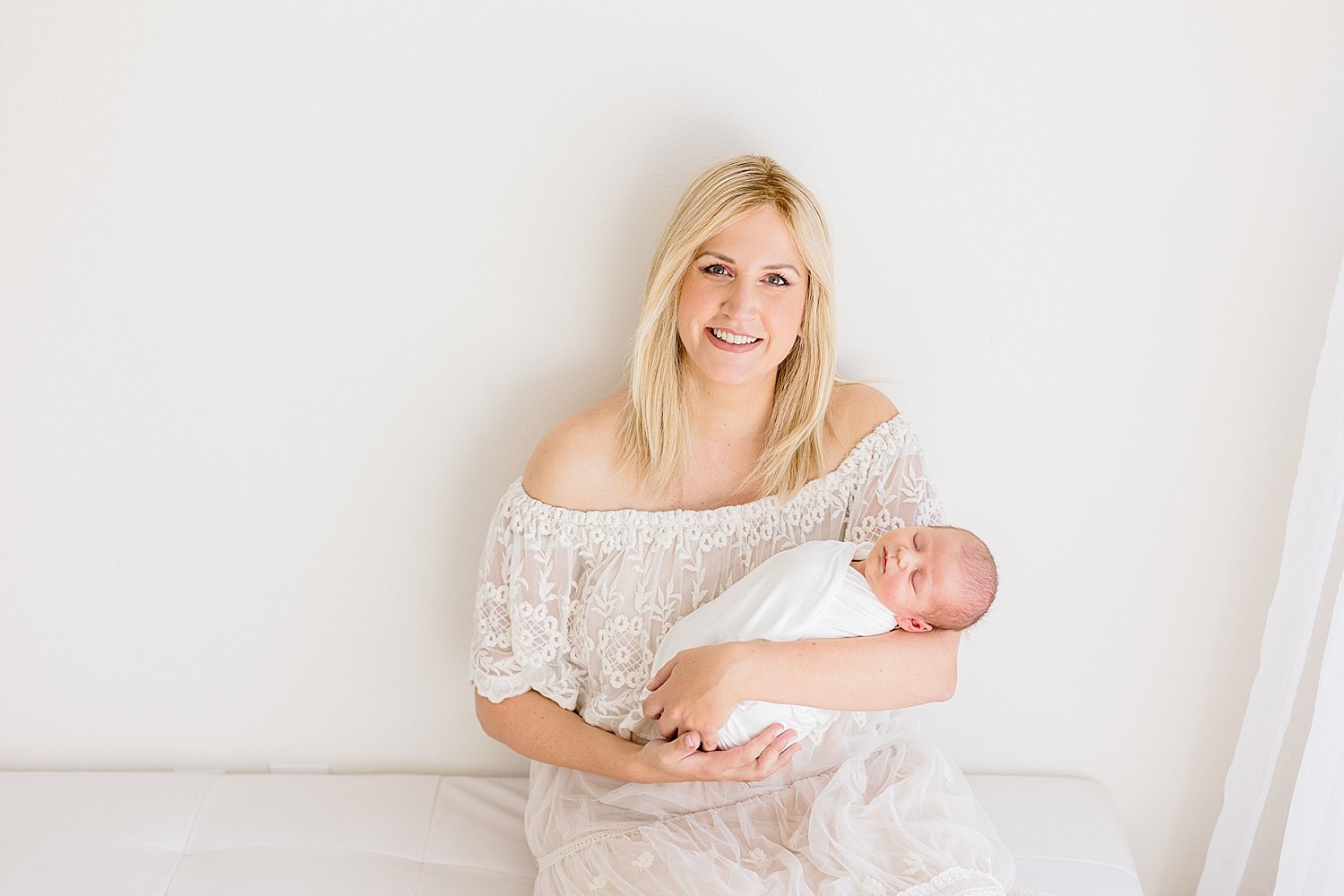 Mom with her baby boy during newborn photos with Ambre Williams Photography.