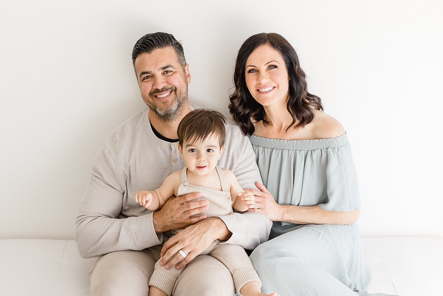 Mom and Dad with one year old son in Newport Beach studio | Ambre Williams Photography
