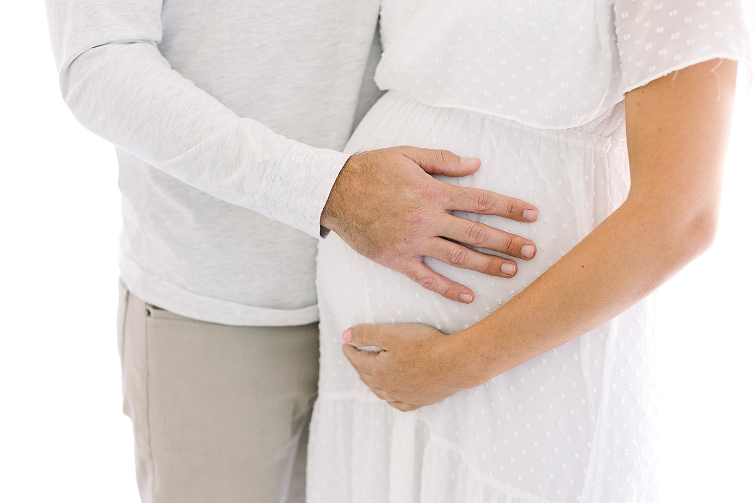 Dad with hand on Mom's pregnant belly | Ambre Williams Photography