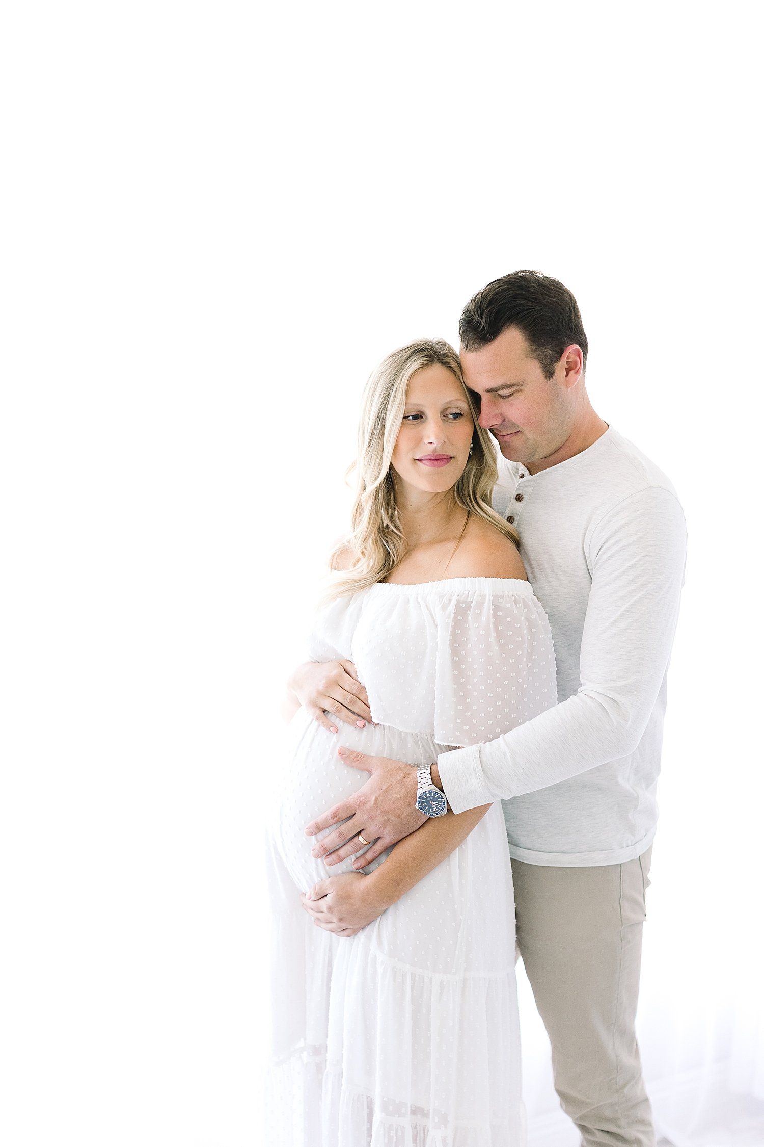 Studio maternity session for expecting parents | Ambre Williams Photography