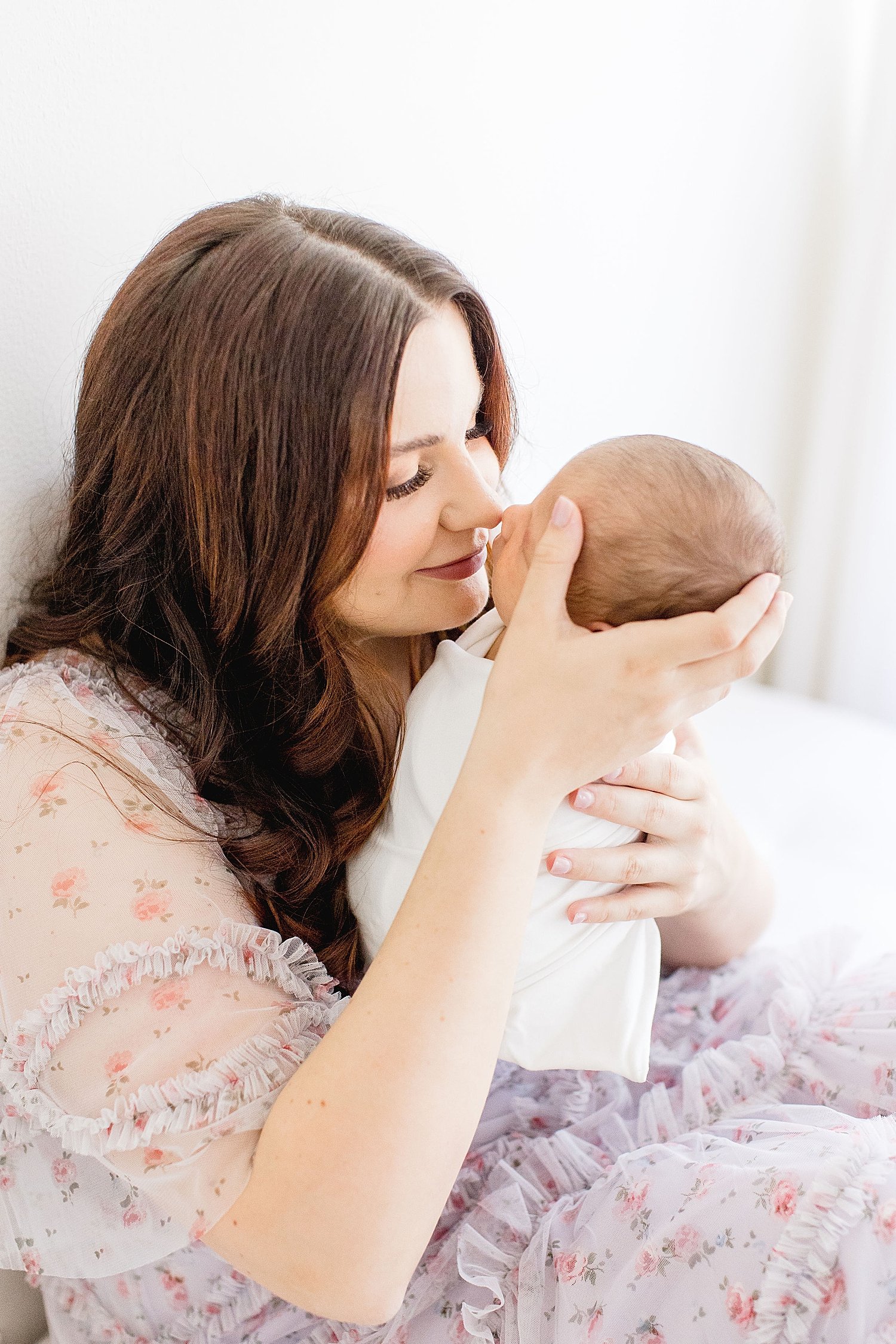 Mom nose to nose with her newborn. Photo by Ambre Williams Photography.