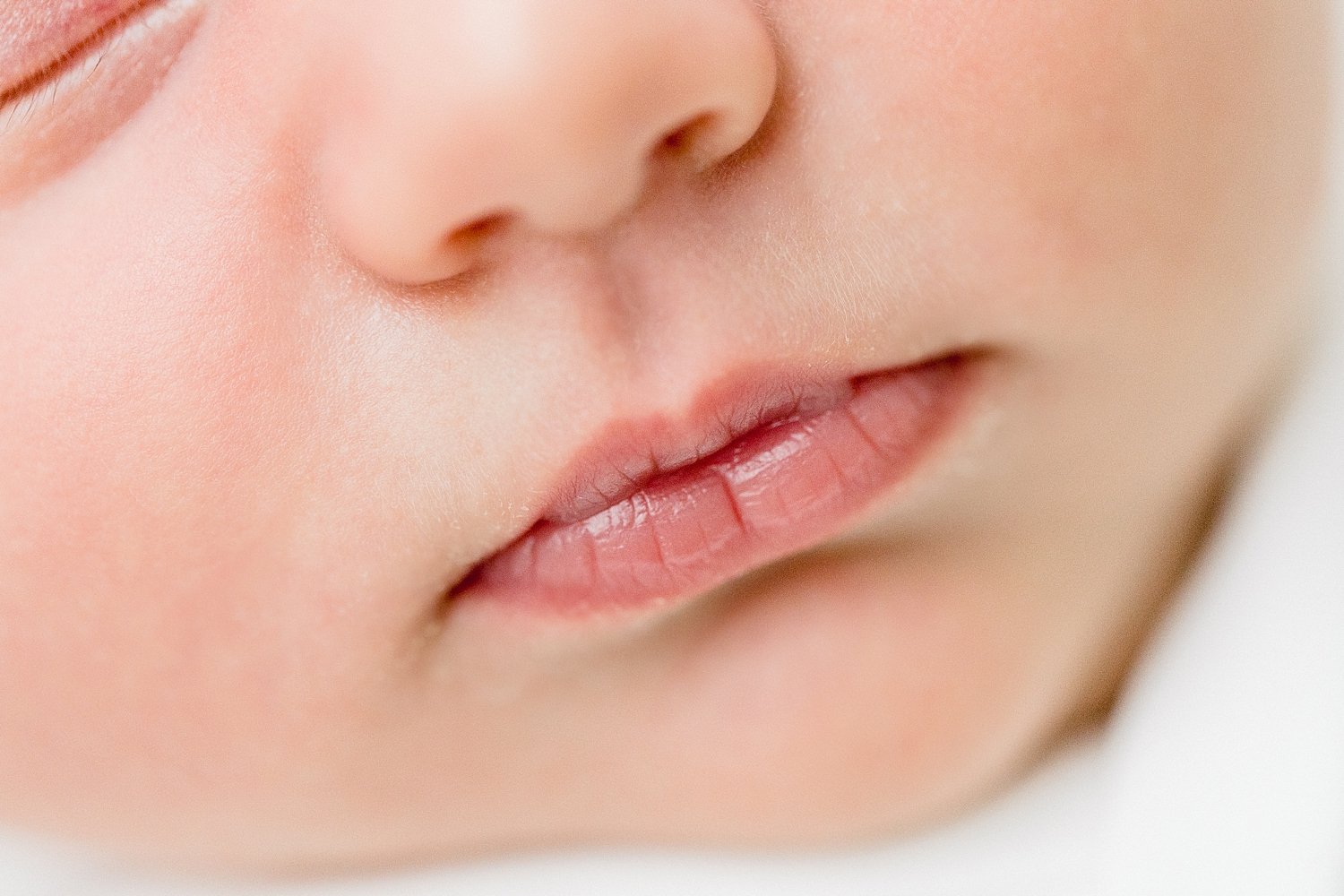 Newborn details of baby lips in studio with Ambre Williams Photography. 