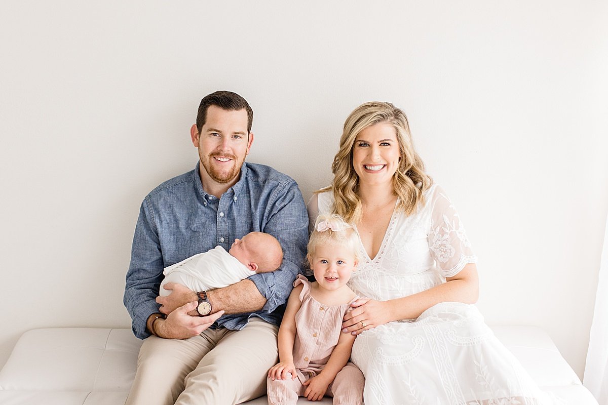 Family Time together with Mom, Dad, Baby, and new big sister during Photography session with Ambre Williams Photograhpy at her studio in Newport Beach