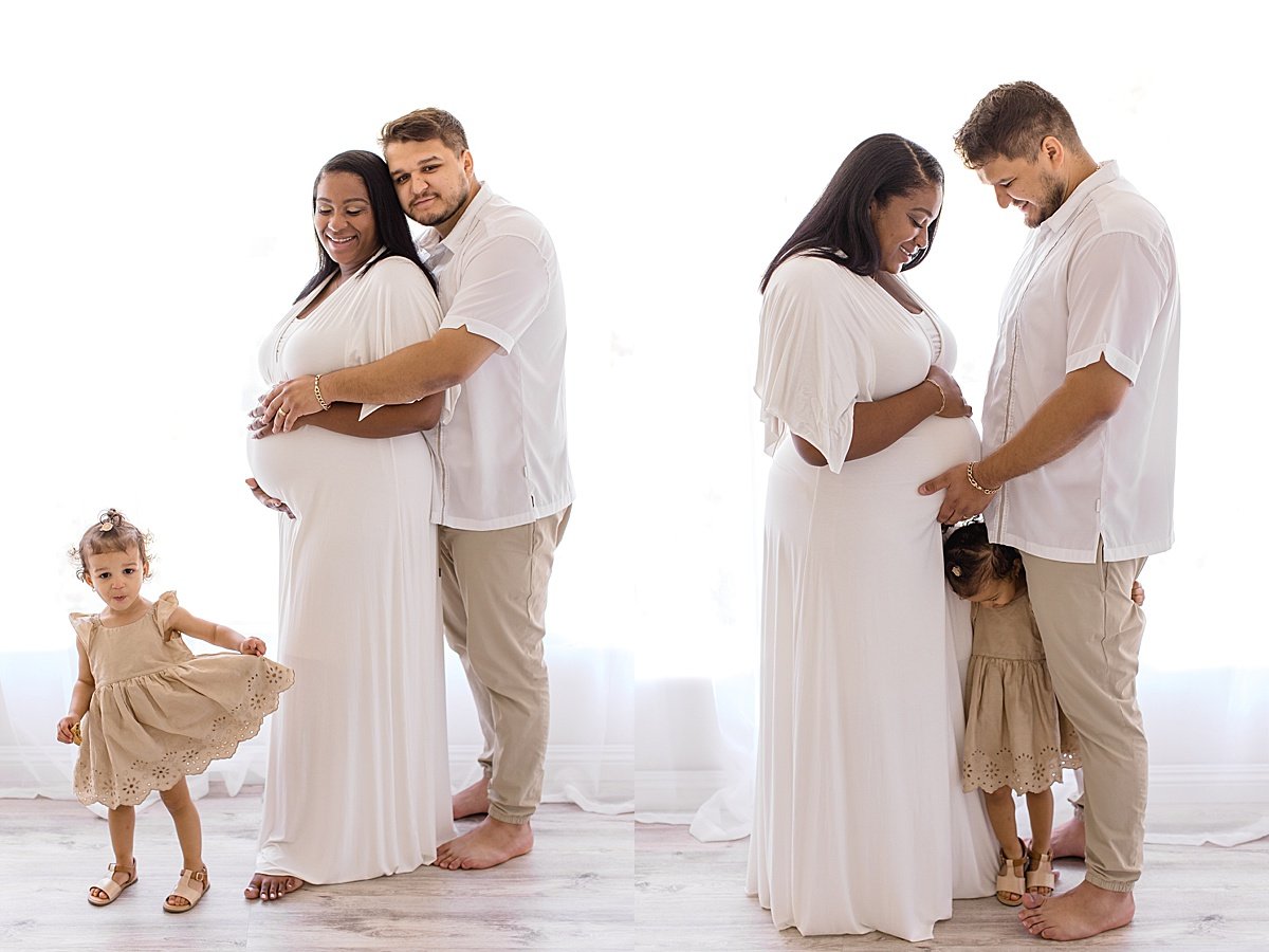 Candid family portrait during maternity studio session with husband, wife, and daughter | Newport Beach Photographer Ambre WIlliams