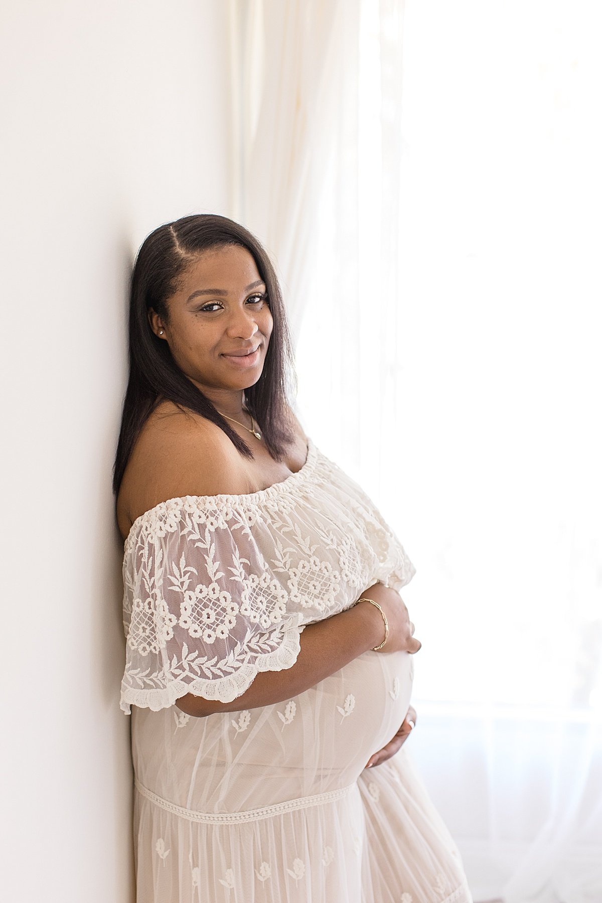 Pregnant Mom during maternity session in Newport Beach with Photographer Ambre Williams