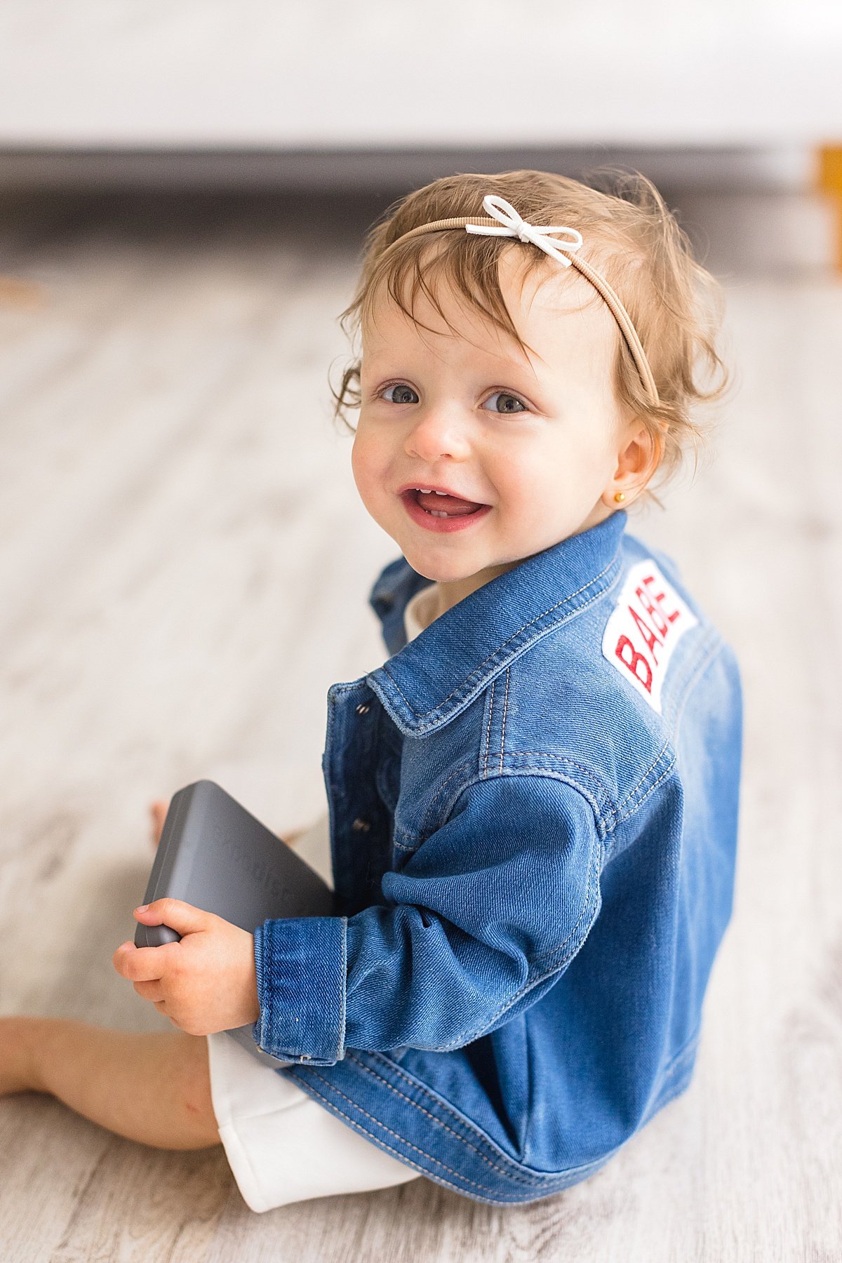 Close-up of One Year old baby in denim jacket | Ambre Williams Photography