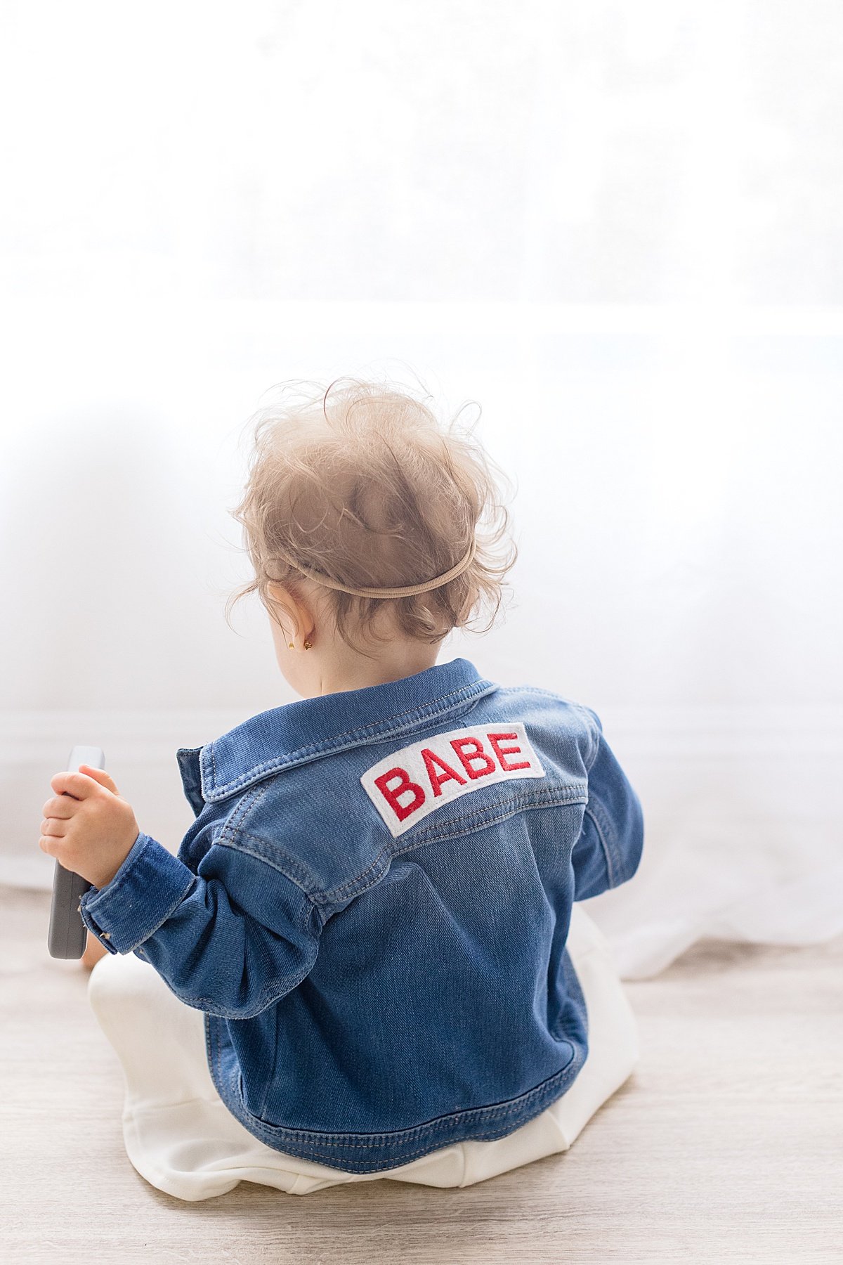 Little Daughter wearing custom denim jacket in Newport Beach Studio Session | Ambre Williams Photography