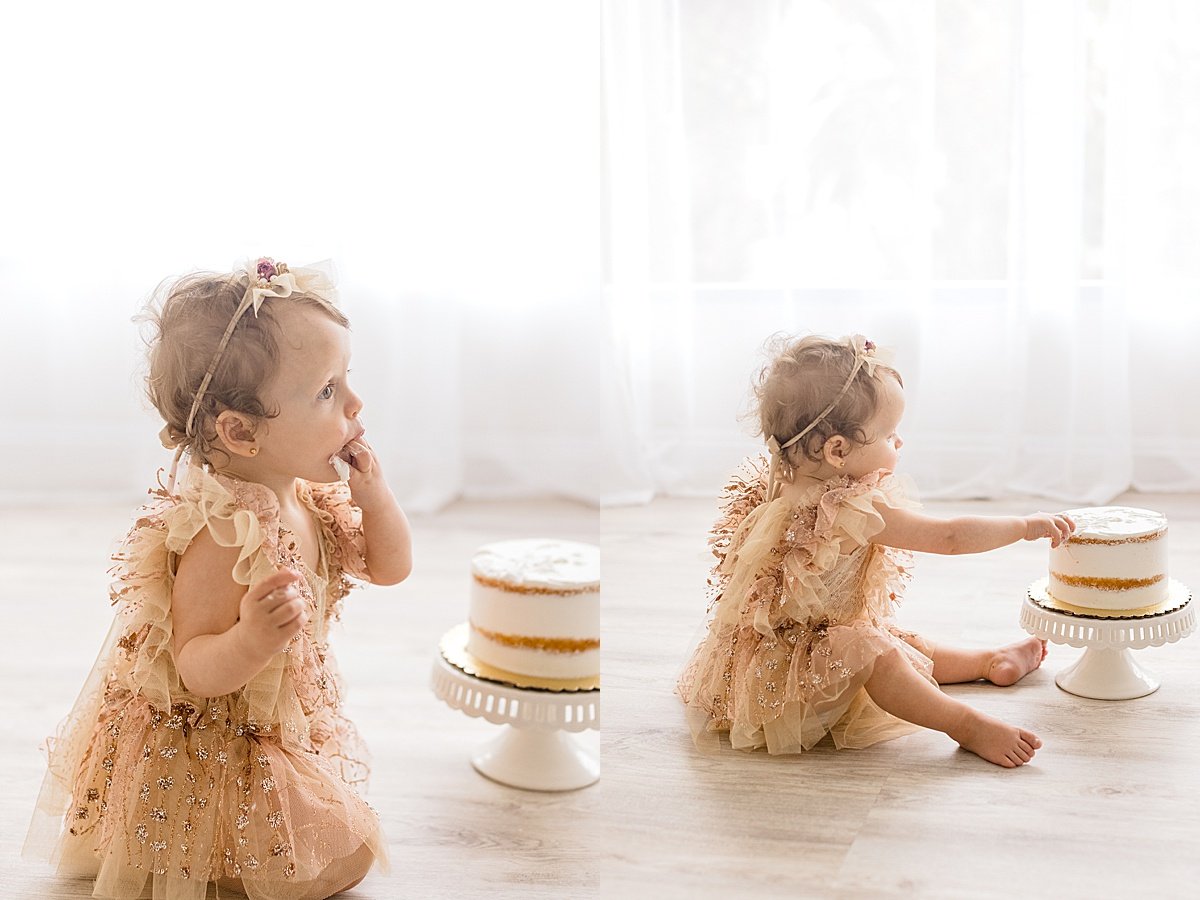 One Year Old Daughter eating birthday cake in pretty dress | Studio Session with Ambre WIlliams Photography in Newport Beach