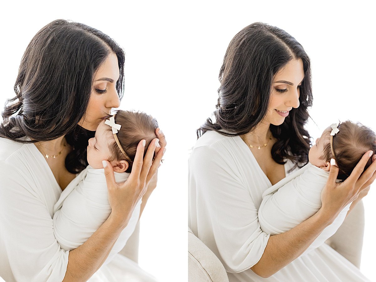 Mom giving her newborn baby kisses during Milestone Session with Ambre Williams Photography in Newport Beach