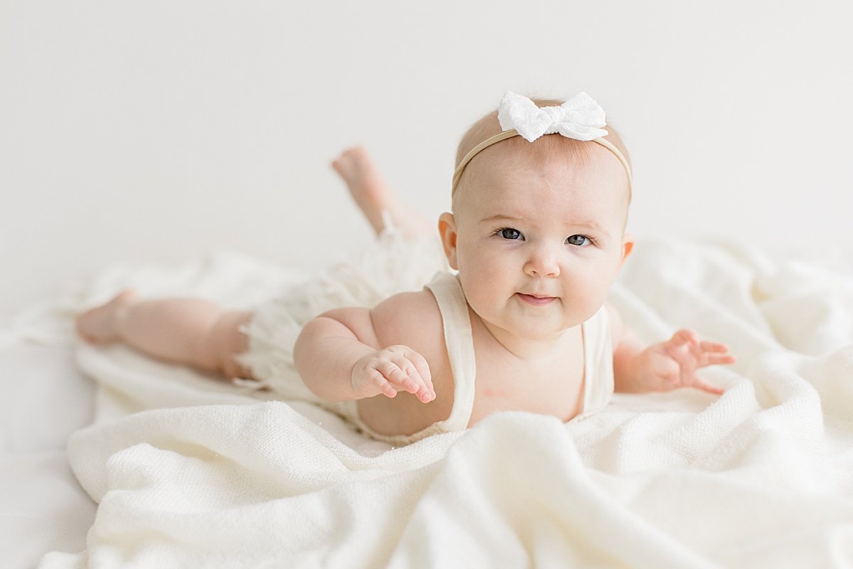 Happy baby girl during milestone portrait session | Newport Beach photographer Ambre Williams