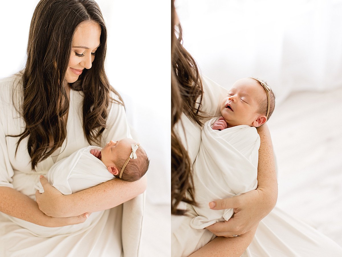 Beautiful Mama and newborn baby girl snuggle together in a portrait session with Ambre Williams Photography in Newport Beach Studio