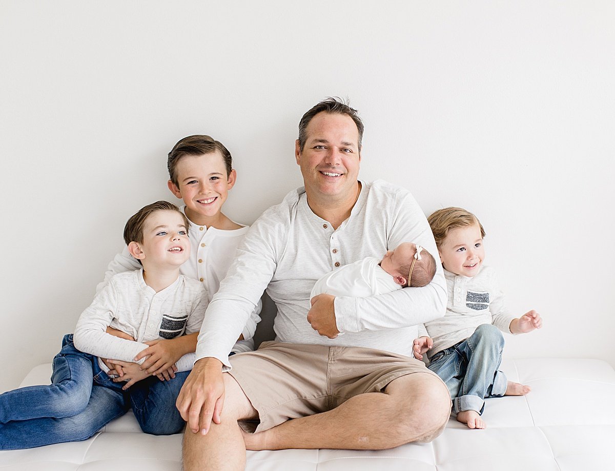 Dad smiling with his four children | Ambre Williams Photography in Newport Beach