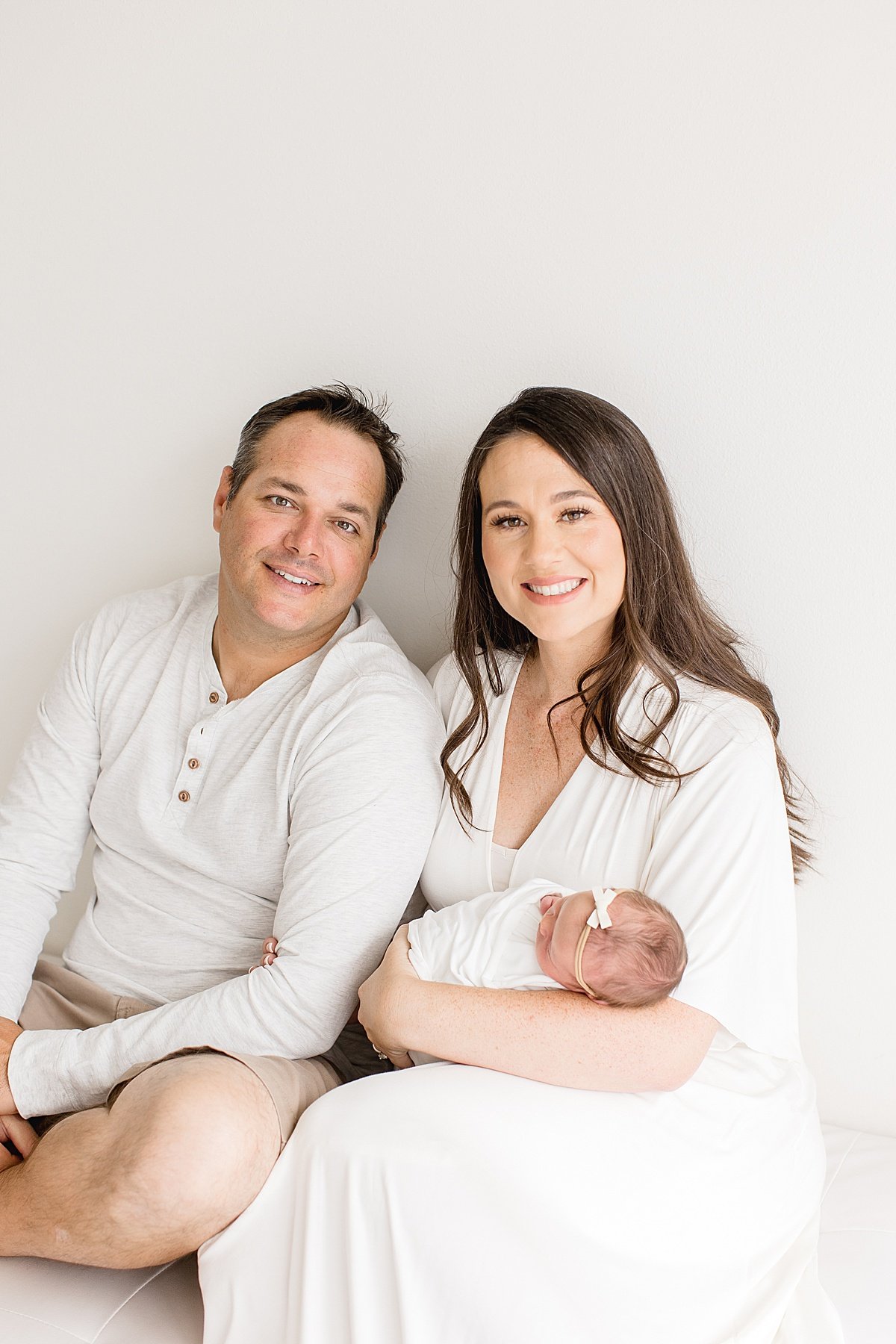 Ambre Williams Photography takes family portraits welcoming new baby sister in her studio in Newport Beach