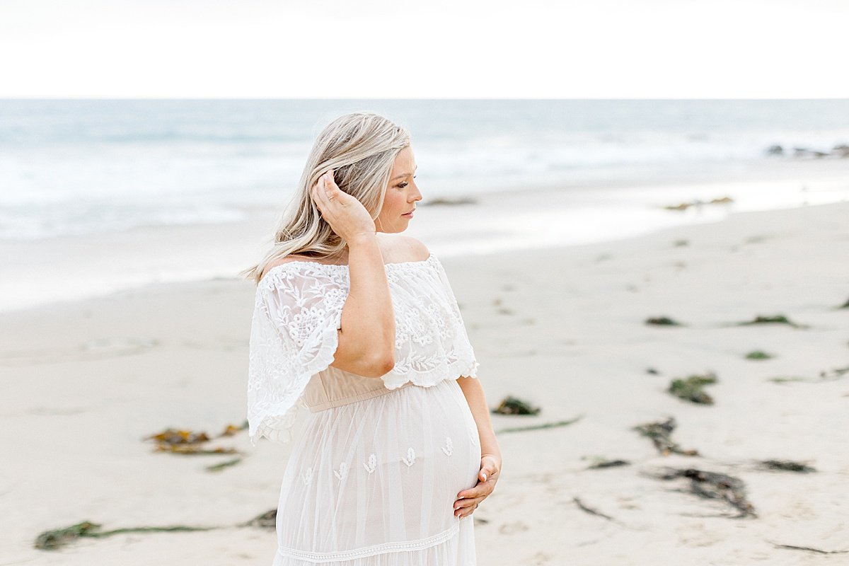 Candid portrait Mom on Beach | Maternity Portrait Session with Ambre Williams in Newport Beach