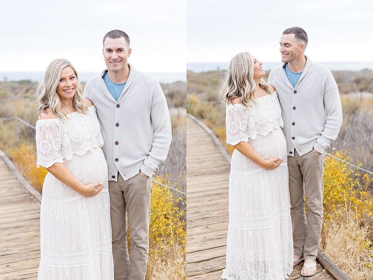 Husband and wife posing during outdoor portrait session with Ambre Williams Photography in newport beach