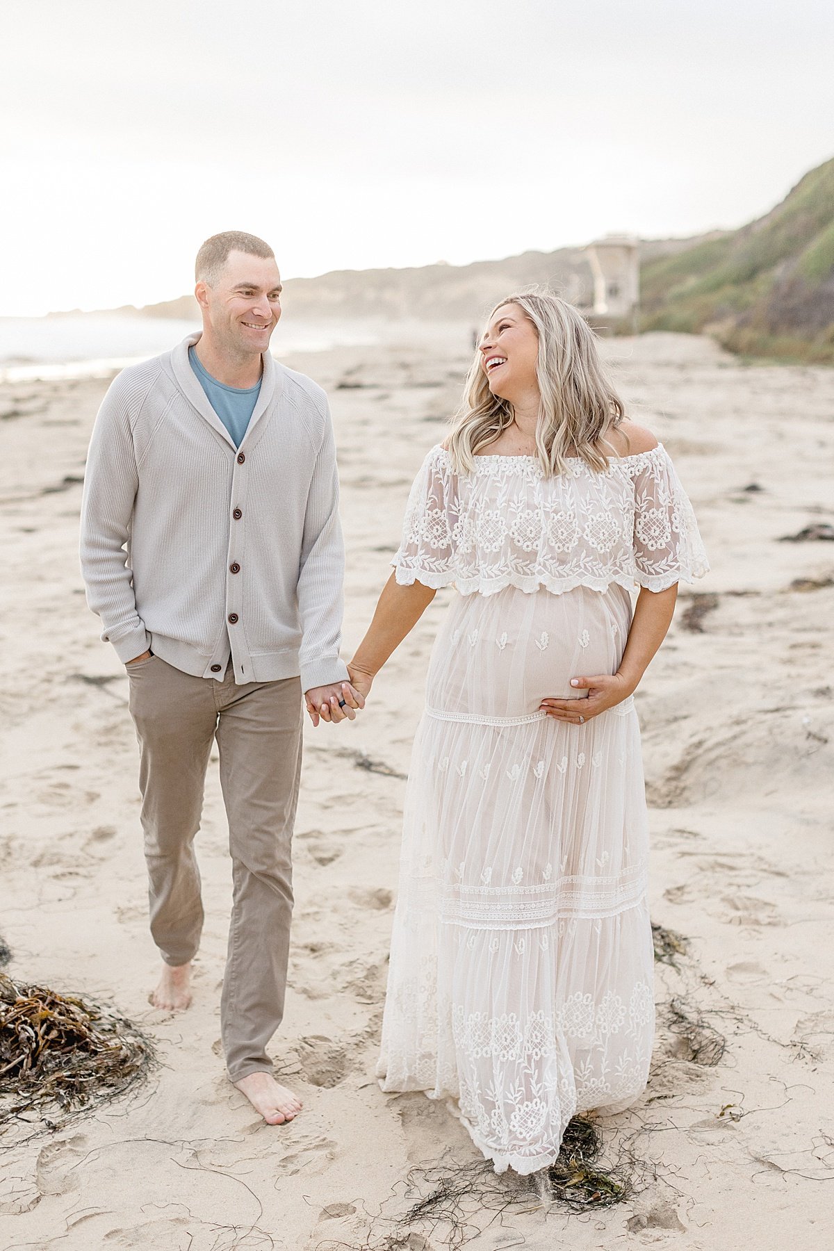 Husband and wife walking together candid portrait | Ambre Williams Photography in Newport Beach