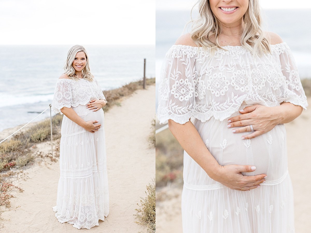 Candid smiling momma holding pregnant belly | Ambre Williams Photography in Newport Beach, CA