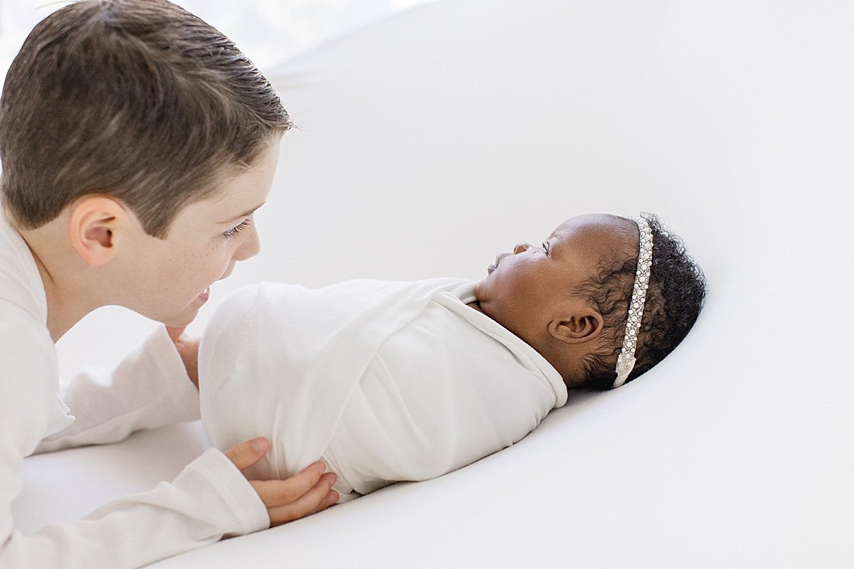 Happy big brother watching over little sister | Studio Session with Ambre Williams Photography