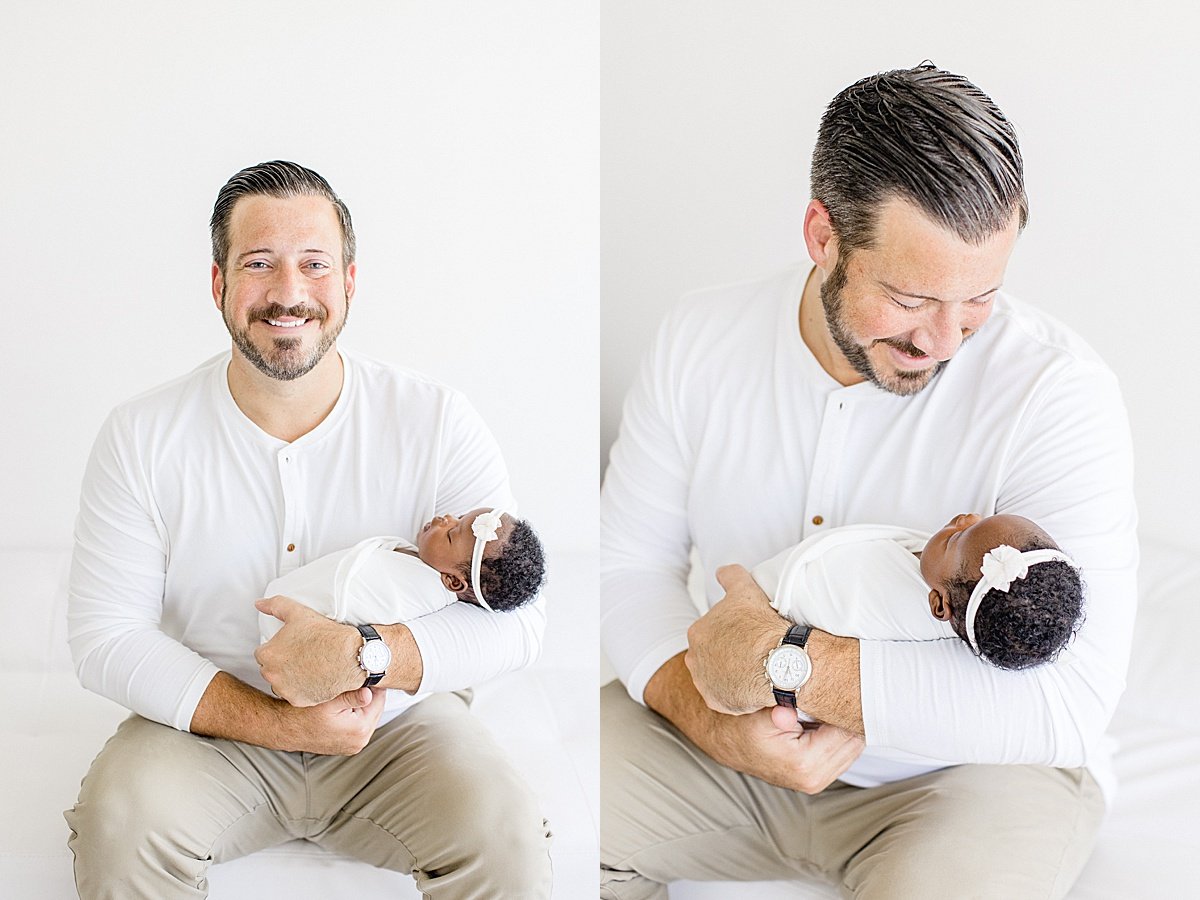 Candid portraits of happy dad holding his newborn daughter | Newport Beach Photographer Ambre Williams