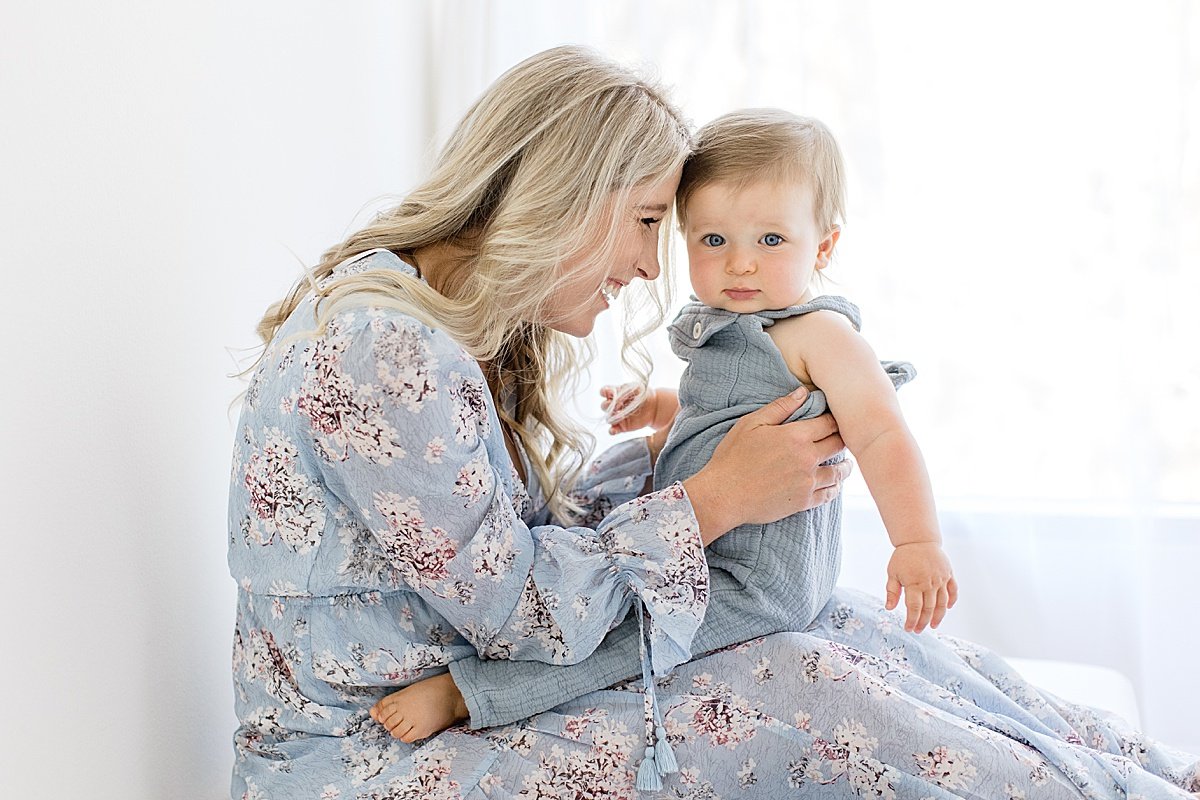 Loving Mama holding her son during portrait milestone session with Ambre Williams Photography in Newport Beach