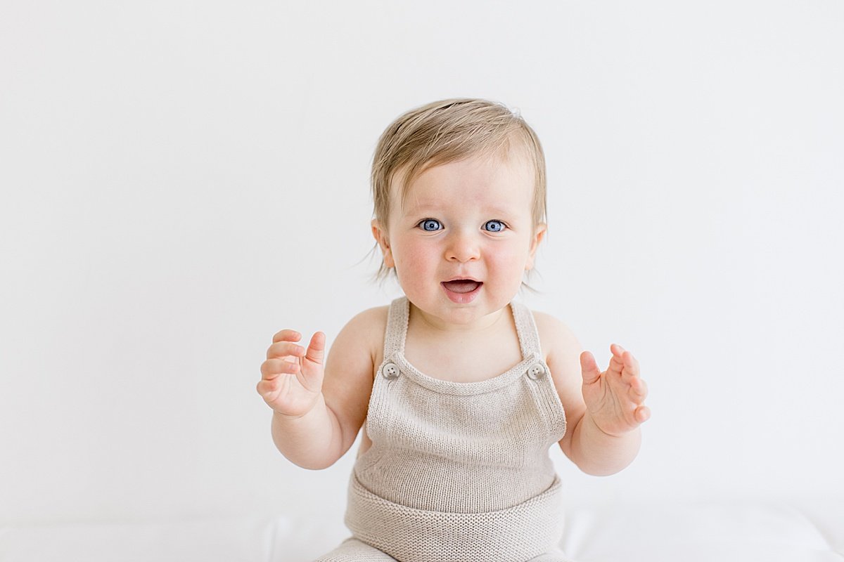 happy smiling baby during first birthday photography session with Ambre Williams in Newport Beach, California